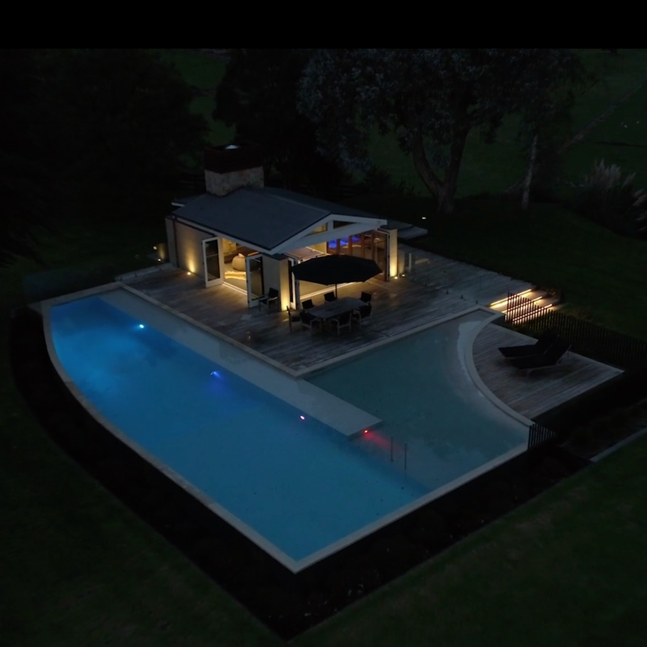 Aerial view of home with pool.