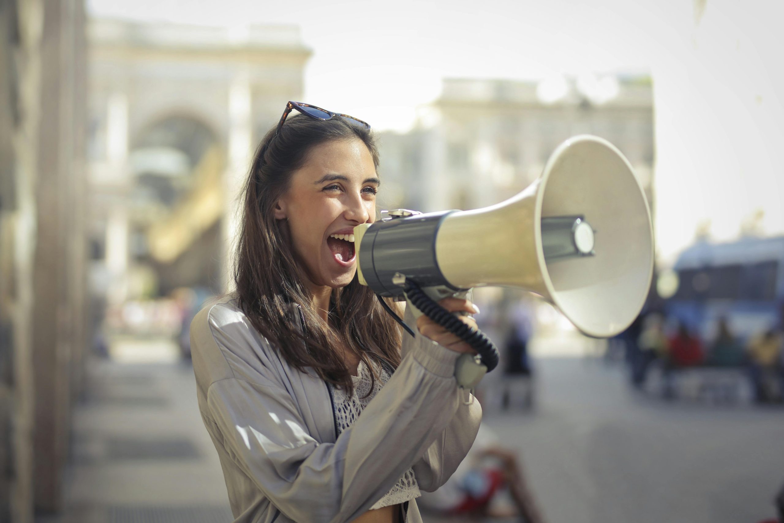 Woman speaking into a megaphone.